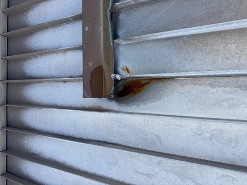 Rust beneath downpipe spreader